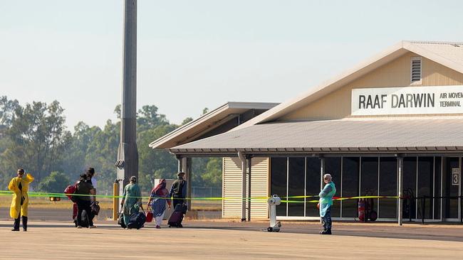 Passengers from the first repatriation flight into Australia from India since flights resumed disembark at RAAF Base Darwin, destined for the Howard Springs quarantine facility. Picture: Supplied by Defence