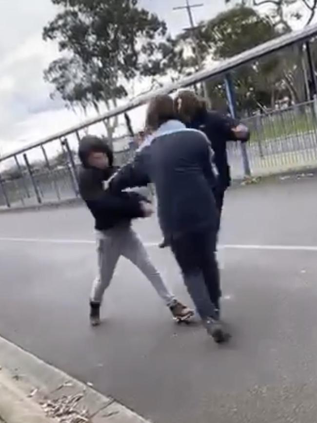 A teacher was forced to step between the trio as the older boy swung the knife at the other student.