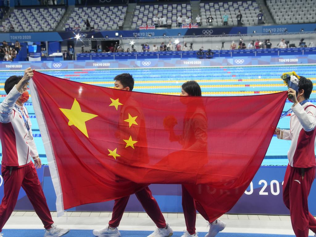 TOKYO, JAPAN - JULY 31: (L - R) Silver medalists Xu Jiayu, Yan Zibei, Zhang Yufei and Yang Junxuan of Team China celebrate on the podium after the Mixed 4Ã&#151;100 metres medley relay on day eight of the Tokyo 2020 Olympic Games at Tokyo Aquatics Centre on July 31, 2021 in Tokyo, Japan. (Photo by Fred Lee/Getty Images)