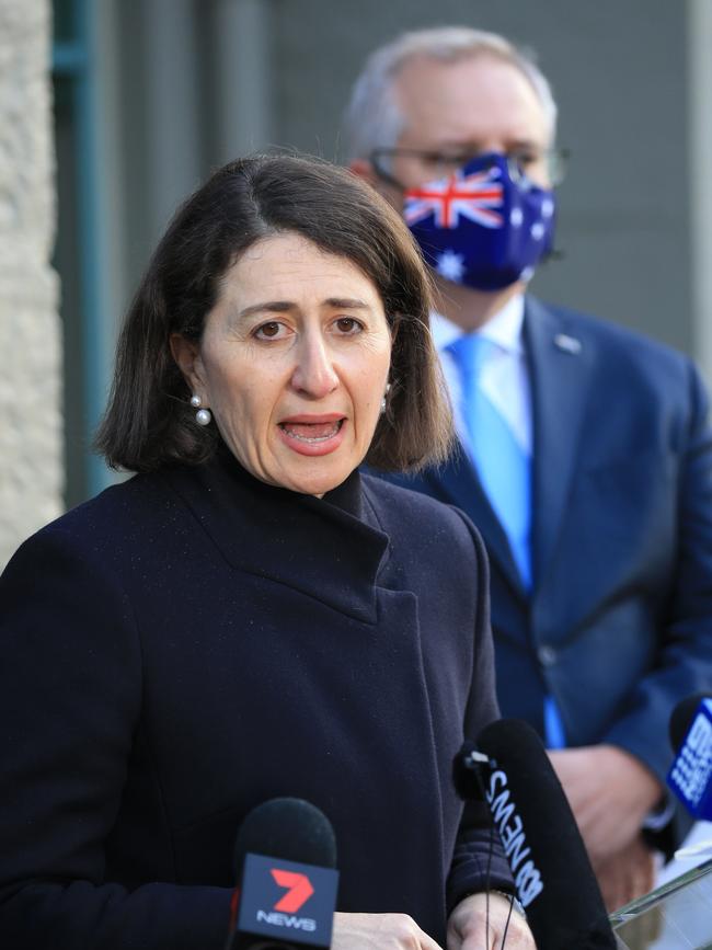 Prime Minister Scott Morrison looks on as NSW Premier Gladys Berejiklian speaks at a press conference in Sydney. Picture: Christian Gilles