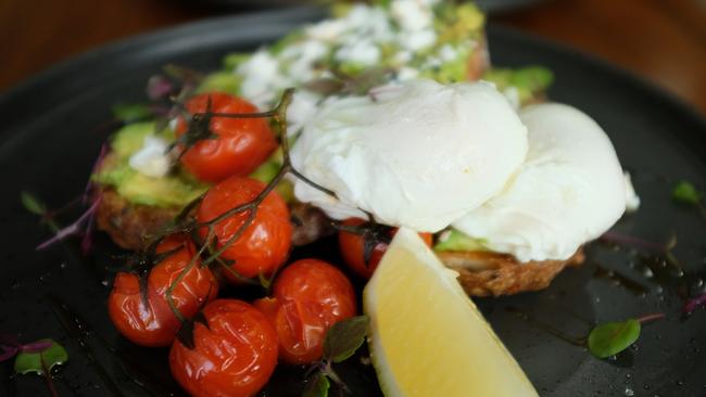 The latest iteration of the Smashed Avocado with truss tomatoes, poached eggs, fetta and lemon ($19).