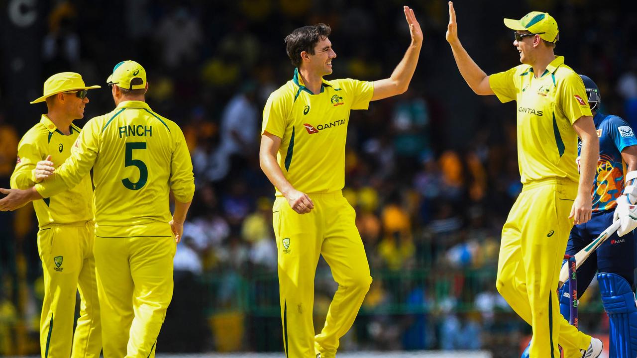 Australia's Patrick Cummins celebrates with teammates. Photo by ISHARA S. KODIKARA / AFP