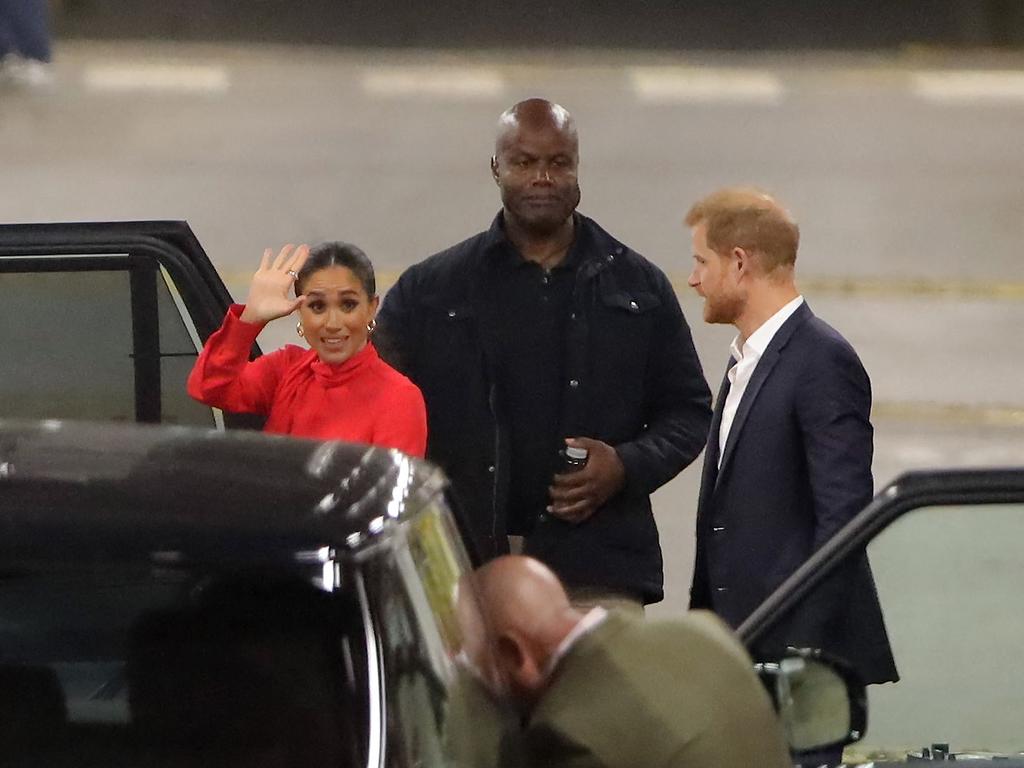 Pere Daobry watches over Prince Harry and Meghan Markle at London’s Euston Station after visiting Manchester on September 5. Picture: Mega Agency