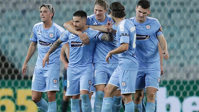 SYDNEY, AUSTRALIA - AUGUST 01: Jamie Maclaren of Melbourne City celebrates scoring a goal with team mates during the round 29 A-League match between Melbourne City and Sydney FC at ANZ Stadium on August 01, 2020 in Sydney, Australia. (Photo by Mark Metcalfe/Getty Images)