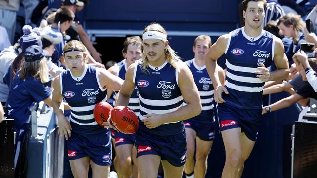 Bailey Smith walks out with teammates to face the Hawks. Picture: Michael Klein.