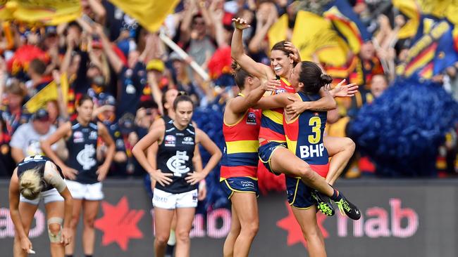 Crows co-captain Chelsea Randall celebrates a goal with teammates Ebony Marinoff and Ange Foley in this year’s AFLW grand final. Picture: Tom Huntley