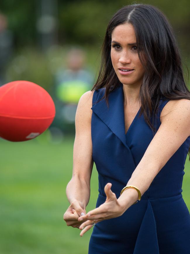 And Meghan pulls it off. Picture: Dominic Lipinski/Pool/Getty Images