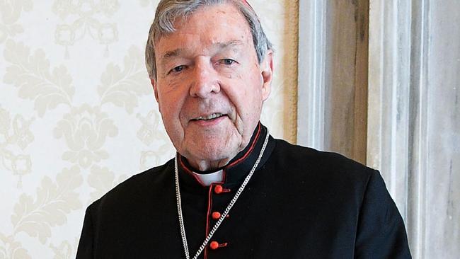 This handout photo taken on October 12, 2020, and released by the Vatican press office, the Vatican Media, shows Pope Francis (L) posing with Australian cardinal George Pell during a private audience at the Vatican. (Photo by Handout / VATICAN MEDIA / AFP)