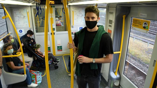 Commuter Nick Coomer (right) says when Sydney trains are packed, ‘you don’t take notice’. Picture: NCA NewsWire/Bianca De Marchi