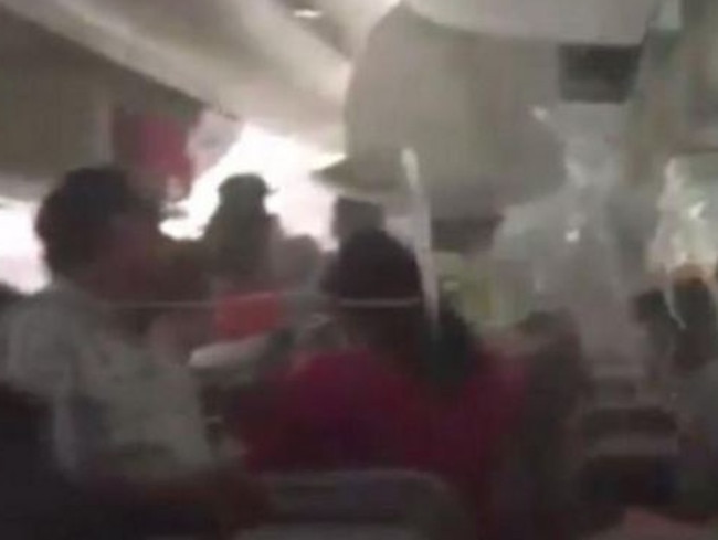 Panic inside the cabin of flight EK521 after crash landing in Dubai.