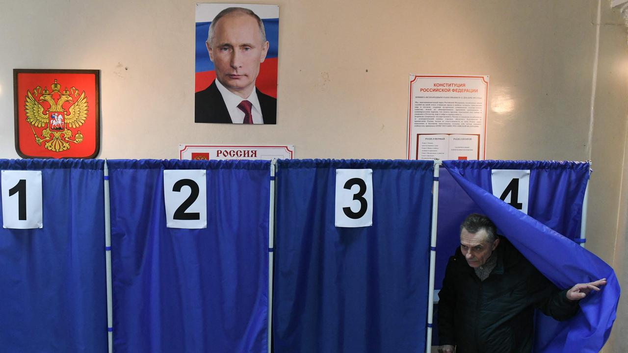 A man votes in Russia's presidential election at a polling station in Donetsk, Russian-controlled Ukraine. Picture: Stringer/AFP