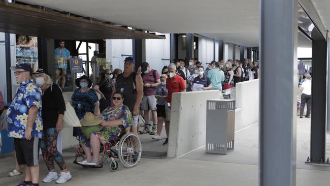 Disembarking tourists who were passengers on the P &amp; O Cruises' Pacific Explorer -the first international cruise ship to dock in at the city since the pandemic. Picture: Arun Singh Mann