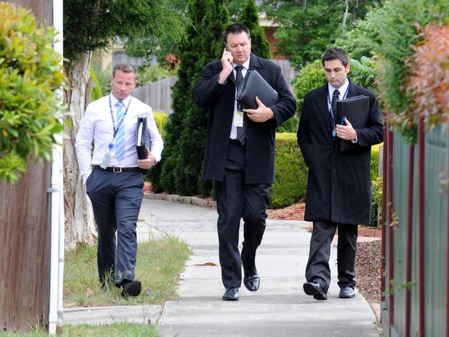 Police at the house of chief racing steward Terry Bailey after the shots were fired. Picture: Andrew Henshaw