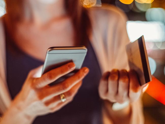 Young woman phoning the bank for credit card support   istock image