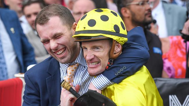 Mark Zahra celebrates his Caulfield Cup victory with Freedman stable manager Brad Taylor. Picture: Reg Ryan/Racing Photos via Getty Images