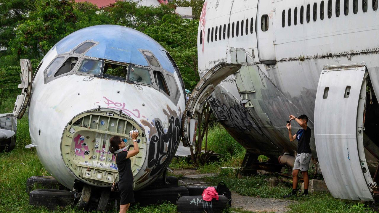 The ‘aeroplane graveyard’ has become a tourist attraction in the Thai capital of Bangkok. Picture: Mladen Antonov / AFP
