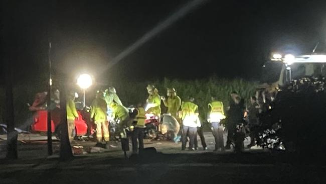 Emergency services at the scene of a fatal crash involving a ute and a truck on the Bruce Highway at Proserpine on August 10.