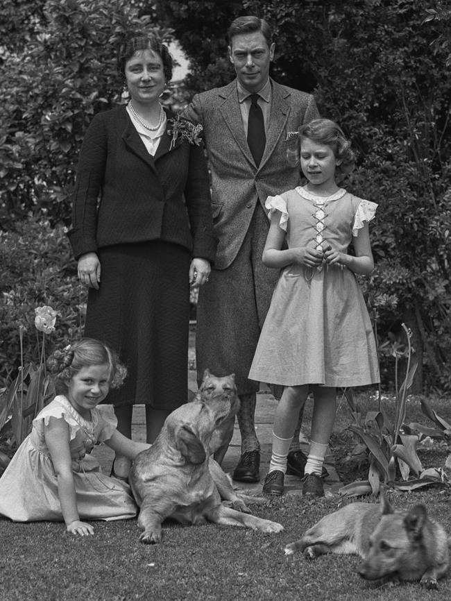 Princesses Margaret and Elizabeth with their mother and father, then the Duke and Duchess of York, with their pembroke welsh corgi dogs, Dookie and Jane, at the Royal Lodge, Windsor in June 1936. Picture: Lisa Sheridan/Studio Lisa/Hulton Archive/Getty Images