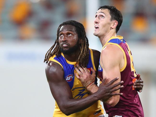 Eagles star Nic Naitanui (left) battle with Lions big man Oscar McInerney. Picture: Chris Hyde/Getty Images