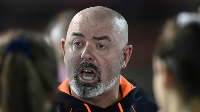 MELBOURNE, AUSTRALIA - MARCH 12: Daniel Harford the coach of the Blues talks to his players during the round 10 AFLW match between the Melbourne Demons and the Carlton Blues at Casey Fields on March 12, 2022 in Melbourne, Australia. (Photo by Quinn Rooney/Getty Images)