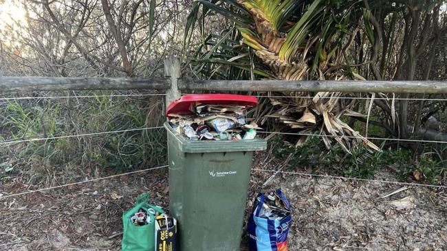 An overflowing bin following New Year’s Eve celebrations at Mooloolaba.