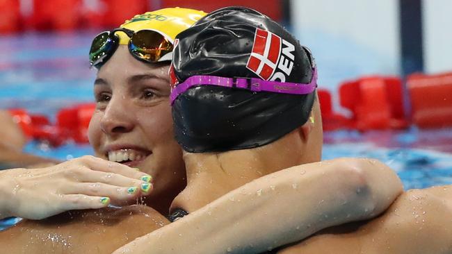 Bronte Campbell congratulates Denmark's Pernille Blume after the 50m freestyle final. Picture: AP Photo/Lee Jin-man.