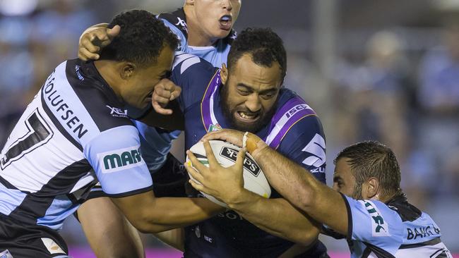 Sam Kasiano of the Storm is tackled during the Round 4 NRL match between the Cronulla-Sutherland Sharks and the Melbourne Storm at Southern Cross Group Stadium in Sydney, Friday, March 30, 2018. (AAP Image/Craig Golding) NO ARCHIVING, EDITORIAL USE ONLY