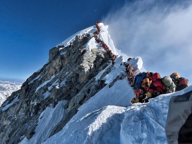 EMBARGO FOR WISH MAGAZINE. 07 FEBRUARY 2025. This handout photo taken on May 22, 2019 and released by @nimsdai Project Possible shows heavy traffic of mountain climbers lining up to stand at the summit of Mount Everest. Three more climbers have died on Everest, expedition organisers and officials said on May 24, taking the toll from a deadly week on the overcrowded world's highest peak to seven. (Photo Handout / @nimsdai Project Possible / AFP) / RESTRICTED TO EDITORIAL USE - MANDATORY CREDIT AFP PHOTO / @NIMSDAI PROJECT POSSIBLE - NO MARKETING NO ADVERTISING CAMPAIGNS - DISTRIBUTED AS A SERVICE TO CLIENTS == NO ARCHIVE