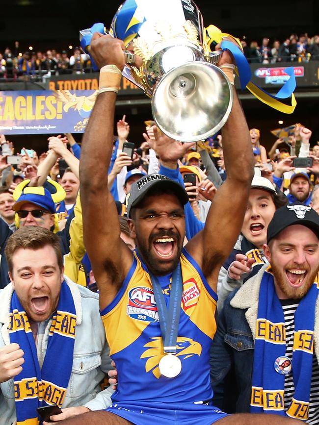 Liam Ryan celebrates with the premiership cup.