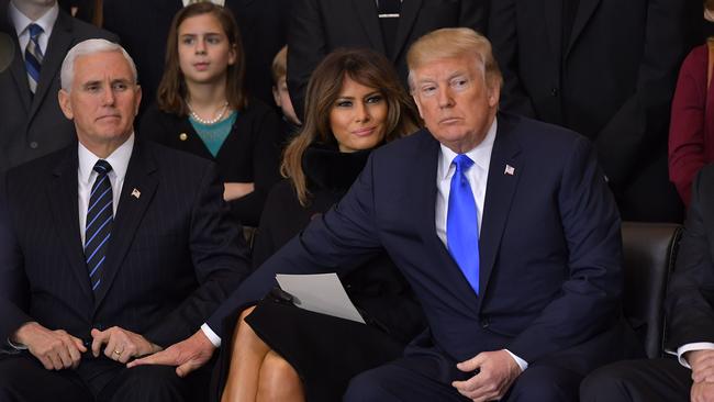 Notice the tender but firm grasp. Picture: Mandel Ngan/AFP