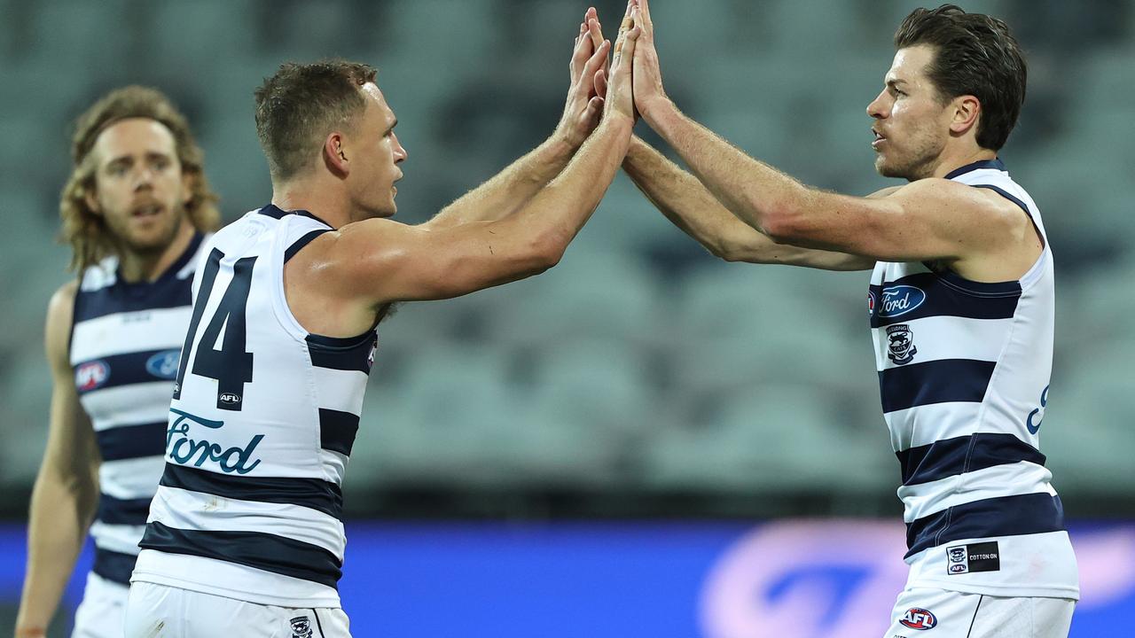 GEELONG, AUSTRALIA - AUGUST 14: Isaac Smith of the Cats celebrates after scoring a goal during the round 22 AFL match between Geelong Cats and St Kilda Saints at GMHBA Stadium on August 14, 2021 in Geelong, Australia. (Photo by Robert Cianflone/Getty Images)