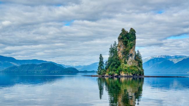 Reflection of New Eddystone Rock in Misty Fjords National Monument near Ketchikan, Alaska.