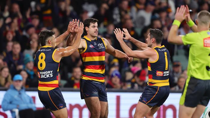 ADELAIDE, AUSTRALIA - MAY 02: Darcy Fogarty of the Crows celebrates a goal with Josh Rachele and Chayce Jones during the 2024 AFL Round 08 match between the Adelaide Crows and the Port Adelaide Power at Adelaide Oval on May 02, 2024 in Adelaide, Australia. (Photo by Sarah Reed/AFL Photos via Getty Images)