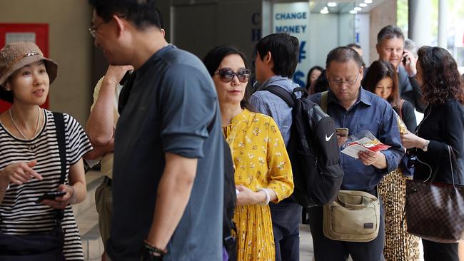 Predominantly Chinese investors lining up to attend a Ralan Group meeting. Picture: Jane Dempster