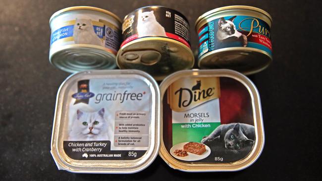 Five cat tins bought from a supermarket. Two products — Purr and Fancy Feast Royale — are intended for supplemental or occasional feeding only as they do not meet minimum AAFCO nutrient standards.