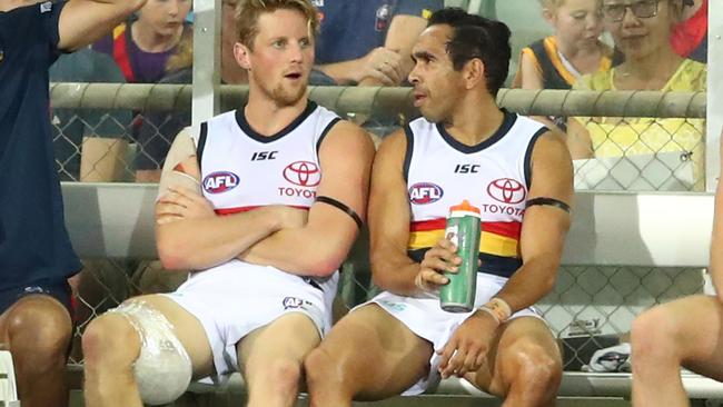 HAMSTRUNG: Rory Sloane, with his left hamstring wrapped in ice, chats with Crows teammate Eddie Betts during the second half of Adelaide’s win against Melbourne in Darwin last Saturday. Picture: SCOTT BARBOUR (Getty Images).