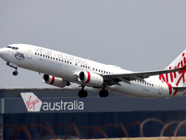 Virgin Australia plane departing from Brisbane Airport Pictures David Clark Photography