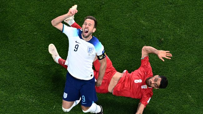 Was this the incident? England forward Harry Kane and Iran defender Morteza Pouraliganji collide during the their Group B match in Doha. Picture: AFP