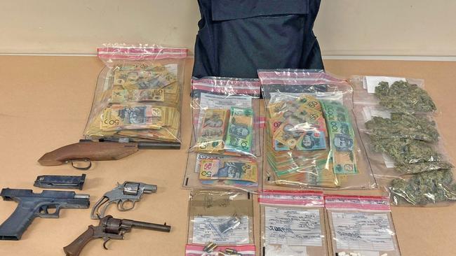 The weapons, drugs and cash seized by police. Photo: Tasmania Police