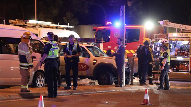 Emergency workers at the scene of the crash on the corner of Glen Osmond Rd. Picture: Dean Martin