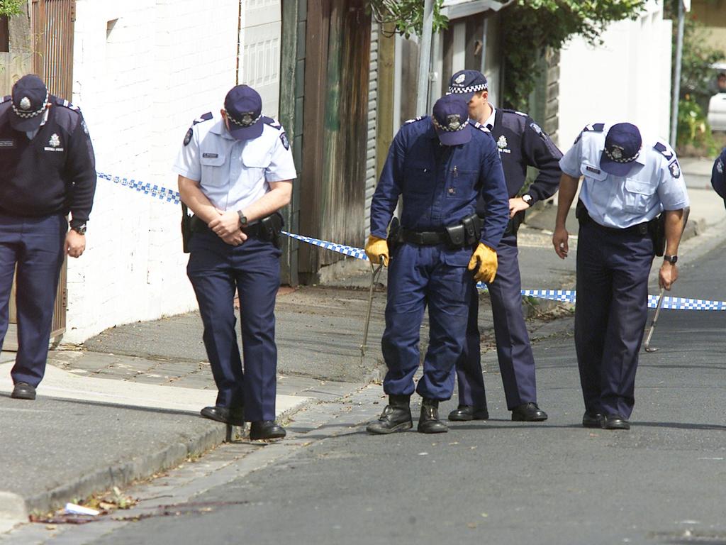 Police hunt for clues after Marshall was executed in front of his son. Picture: Peter Smith