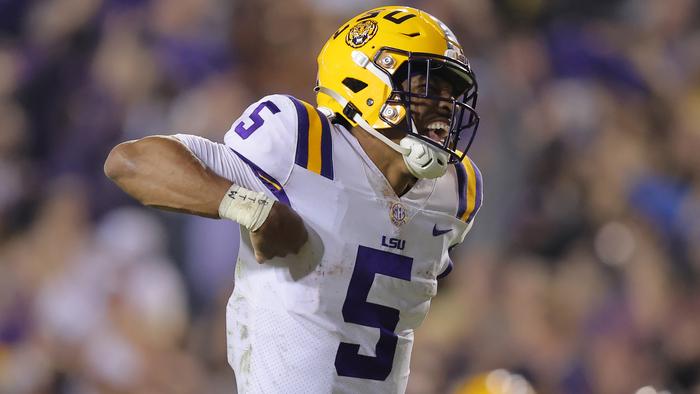 BATON ROUGE, LOUISIANA - NOVEMBER 05: Jayden Daniels #5 of the LSU Tigers celebrates throwing for a touchdown during the fourth quarter against the Alabama Crimson Tide at Tiger Stadium on November 05, 2022 in Baton Rouge, Louisiana. (Photo by Jonathan Bachman/Getty Images)