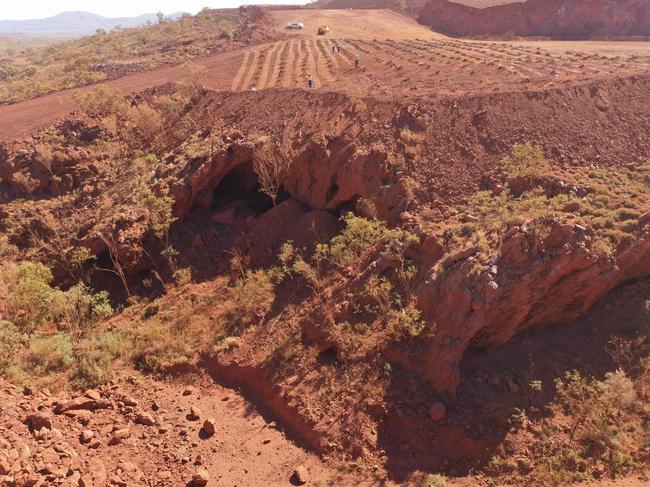 (FILES) This handout file photo taken on May 15, 2020 and released by the PKKP Aboriginal Corporation and received by AFP on May 27, 2020 shows Juukan Gorge in Western Australia -- one of the earliest known sites occupied by Aboriginals in Australia. - Rio Tinto announced the resignation of its CEO and two top lieutenants on September 11, 2020 over the mining giant's destruction of a 46,000-year-old Aboriginal site to expand an iron ore mine in Australia. The Anglo-Australian firm faced a growing investor revolt over the destruction of the sacred site in the Juukan Gorge in Western Australia's remote Pilbara region -- one of the earliest known locations inhabited by Australia's indigenous people. (Photo by Handout / PKKP Aboriginal Corporation / AFP) / RESTRICTED TO EDITORIAL USE - MANDATORY CREDIT "AFP PHOTO / PKKP ABORIGINAL CORPORATION" - NO MARKETING NO ADVERTISING CAMPAIGNS - DISTRIBUTED AS A SERVICE TO CLIENTS - NO ARCHIVES