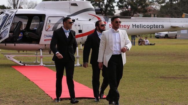 Auburn deputy mayor Salim Mehajer holds a lavish wedding in Lidcombe which involved helicopters, supercars, motorbikes, fighter jets a d dancing drummers and closed off Frances St. Salim is all smiles after he and his groomsmen arrived at Phillips Park by helicopter. picture: Toby Zerna