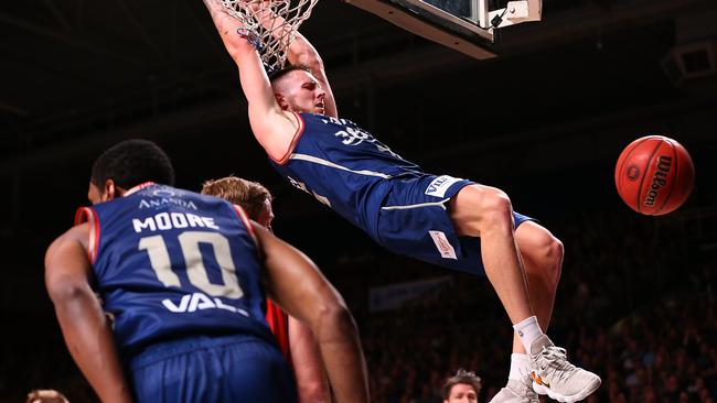 Mitch Creek throws down a slam dunk in Adelaide’s 109-74 win over Perth to start their NBL semi-final series. Picture: Paul Kane (Getty).