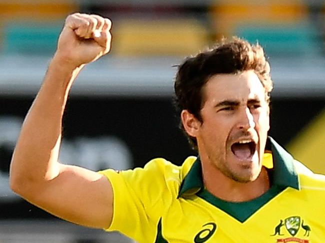 BRISBANE, AUSTRALIA - JANUARY 19:  Mitchell Starc of Australia celebrates taking the wicket of Jason Roy of England during game two of the One Day International series between Australia and England at The Gabba on January 19, 2018 in Brisbane, Australia.  (Photo by Bradley Kanaris/Getty Images)