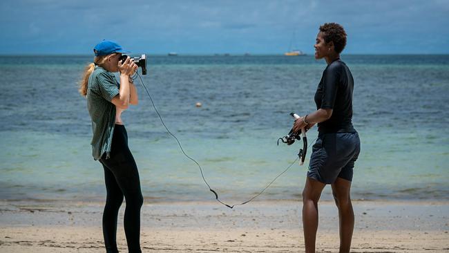 Yasmine Wright Gittins filming and interviewing Kolora Malimali, a Fijian marine biologist working on coral reef restoration efforts around Malolo Lailai island, Fiji. Picture: Supplied