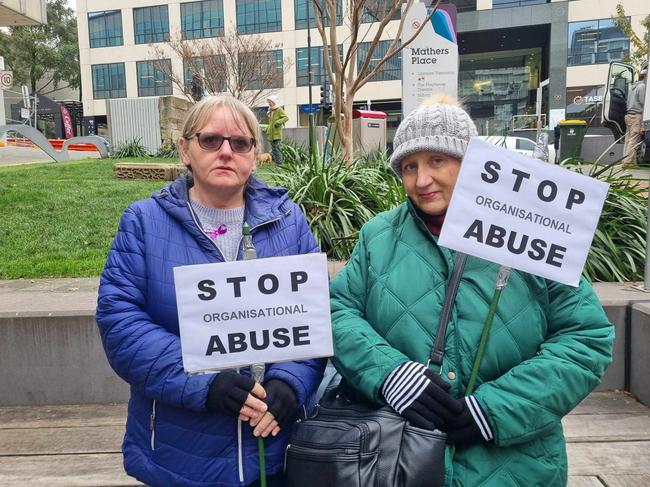 Frances and Paula Xiberras speak out against elder organisations that can commit abuse after the Walk Against Elder Abuse Hobart CBD. Picture: Elise Kaine