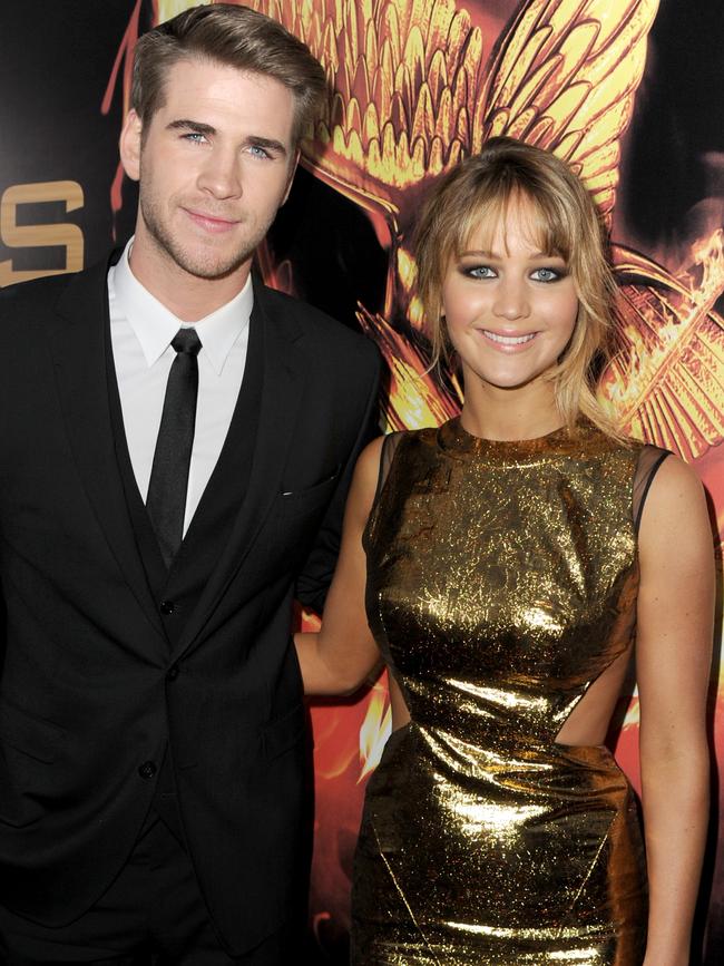 Lawrence and Hemsworth at the <i>Hunger Games</i> premiere. Picture: Kevin Winter/Getty Images)