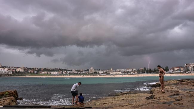 A lightning storm looms over Sydney’s Bondi Beach. Picture: Flavio Brancaleone